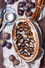 German plum cake with cinnamon, served with ice cream and coffee.