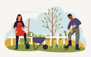 Two gardeners are working in a spring garden, using shovels and a wheelbarrow filled with plants, surrounded by a white picket fence and a newly planted tree