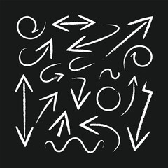 Collection of hand drawn chalk arrows and symbols on a black background