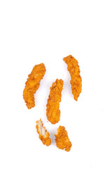 Fried chicken breast strips on white background. Isolated chicken crisps