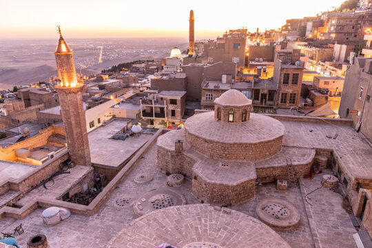 Evening view of the old town in Mardin with Emir Hamami baths in the foreground, Turkey