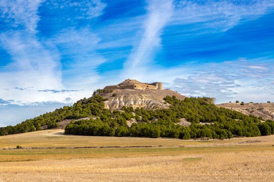 The ruins of the medieval Castle of Torremormoj&oacute;n on a prominent hill (mota) overlooking the rural landscape of Palencia, Spain