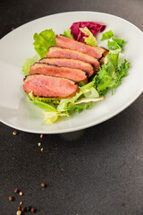 Duck breast roast poultry fresh natural product tasty snack delicious gourmet food background on the table rustic top view copy space