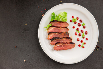 Duck breast roast poultry fresh natural product tasty snack delicious gourmet food background on the table rustic top view copy space