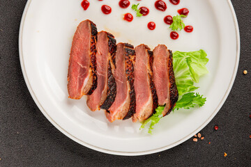 Duck breast roast poultry fresh natural product tasty snack delicious gourmet food background on the table rustic top view copy space