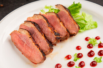 Duck breast roast poultry fresh natural product tasty snack delicious gourmet food background on the table rustic top view copy space