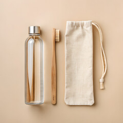 Eco-friendly essentials for a sustainable lifestyle: a bamboo toothbrush, glass water bottle and reusable cotton bag promote healthy living on the go