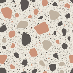 A close up view of a terrazzo pattern with neutral and earthy tones.