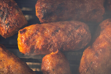 Pork chops, steak, sausages on barbecue grill
