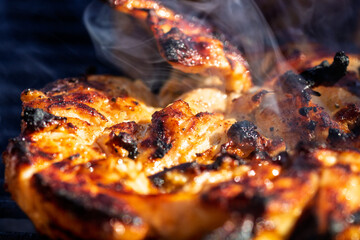 Pork chops, steak, sausages on barbecue grill