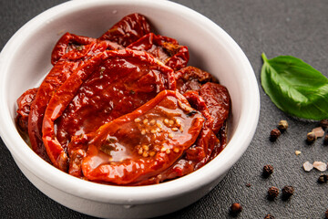 Sun-dried tomatoes snack vegetables natural product tasty snack fresh delicious gourmet food background on the table rustic top view copy space keto and paleo diet vegan and vegan food