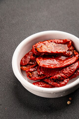 Sun-dried tomatoes snack vegetables natural product tasty snack fresh delicious gourmet food background on the table rustic top view copy space keto and paleo diet vegan and vegan food