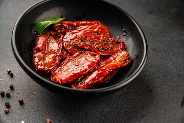 Sun-dried tomatoes snack vegetables natural product tasty snack fresh delicious gourmet food background on the table rustic top view copy space keto and paleo diet vegan and vegan food