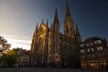 Fototapeta premium Historic Catholic church built in Gothic style with pointed arches and ornate details, perfect for architecture, culture, and heritage themes.