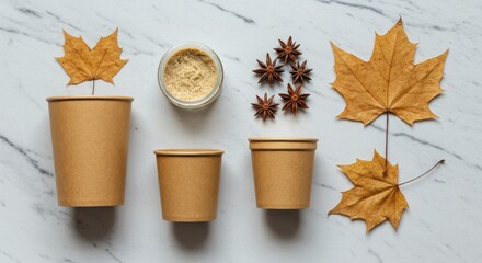 Autumnal composition of kraft paper cups star anise and maple leaves isolated on white background