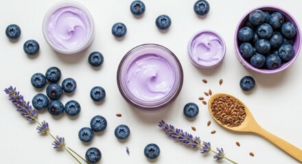 Natural skincare ingredients featuring blueberries lavender and flax seeds isolated on white background