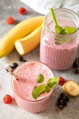 Refreshing mixed berry and banana smoothie with mint garnish