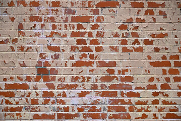 Brick wall painted red white paint