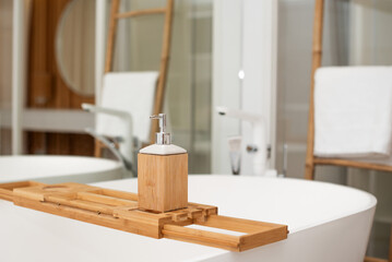 Elegant bathroom setup with bamboo accessories and a stylish tub in a modern home environment