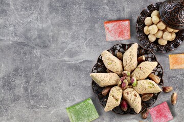 Traditional plate with sweet date fruits and tea