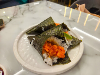 Japanese Temaki Hand Rolls on Marble Table