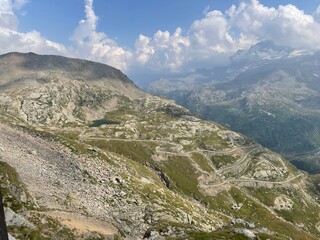 Panoramic view of the Nivolet Lakes, located in the Gran Paradiso National Park between Piedmont and Aosta Valley, Italy. The scene features two alpine lakes — Lago Serrù and Lago Agnel