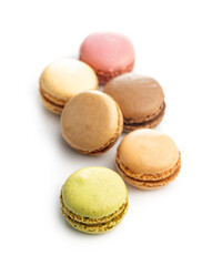 Different flavors of macarons. Colourful macaroons isolated on white background.