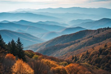 Obraz premium Autumnal Vista of Layered Mountain Ranges with Colorful Trees and Blue Hues in Distance