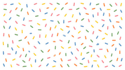 Flat lay photograph of colorful sprinkles on a white background