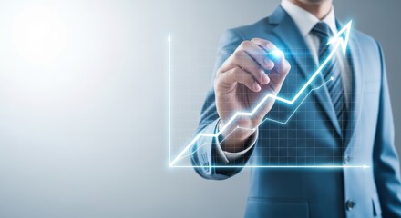 Naklejka na ściany i meble Businessman in a suit drawing an upward trending financial graph on a transparent screen, symbolizing growth and success in business