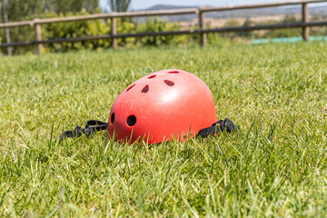 A red helmet on the green grass background