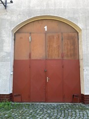 Historic architecture and urban environment. Entrance door viewed from the street.