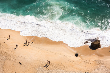 Aerial view of the waves on the beach in Nazaré, Portugal