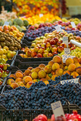 Colorful Fresh Fruit Market in Albania – Vibrant Display of Grapes, Peaches, Apples, and Seasonal Produce with Local Prices