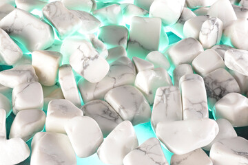 White polished stones texture background and green light