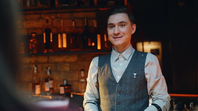 Closeup barman working bar counter. Man providing cocktails making workshop