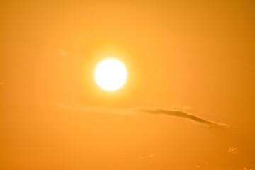 Beautiful sky background - Sunset Sunrise sky with light clouds and real sun, Morning sun bursting through cloudbank, Ideal for summer-themed designs, backgrounds, or concepts relat, Orange sky.