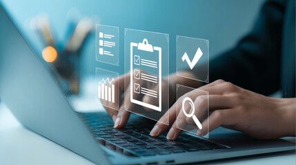 Hands typing on a laptop with digital interface showing checklist magnifying glass and checkmark symbols representing business process and data analysis