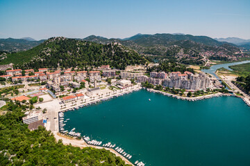 Fototapeta premium PLOCE, CROATIA – June 16, 2019: Panoramic view of the coastal town, ferry port, church, and Adriatic waterfront on a bright summer day