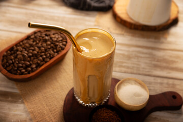 Dalgona Coffee, a cold, sweetened whipped beverage made with milk and frothy coffee cream made with instant coffee, a trendy, refreshing, and easy recipe.