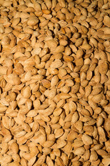 Shelled dry almonds on display for sale at local food market.