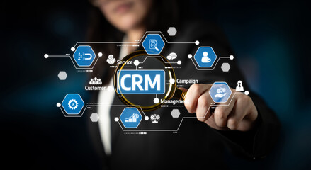 A business professional interacts with a digital CRM interface, showcasing various features and tools for customer relationship management in a modern workspace environment. Tessel