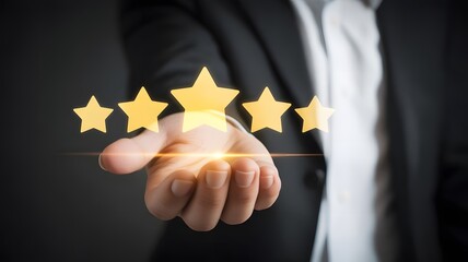 Hand holding five golden stars representing excellent customer service and quality rating