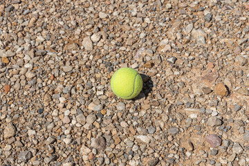 Tennis ball on the brown background