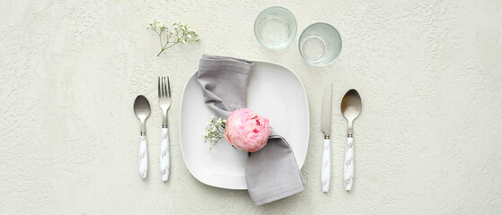 Beautiful table setting with peony flower on white background. Top view