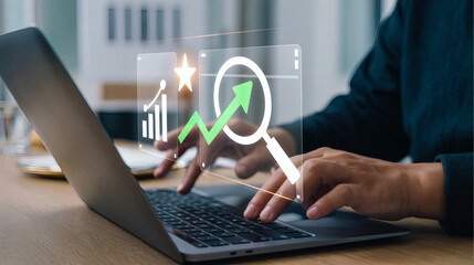 Close up of hands typing on a laptop with a holographic financial growth chart overlay showing upward trends and analysis