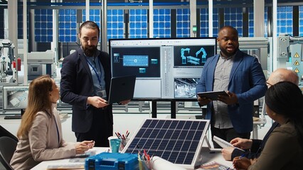 Factory executives present sustainable manufacturing solutions to investors. Industrial plant executives pitching innovative solar panel production automation technologies to shareholders, camera A