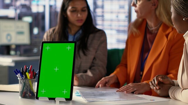 Entrepreneurs team with a success story work next to green screen, using professional tools to meet project deadline and obtain business growth. Leadership skills and professionalism. Camera A.