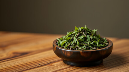 handful of Gyokuro tea on a wooden stand