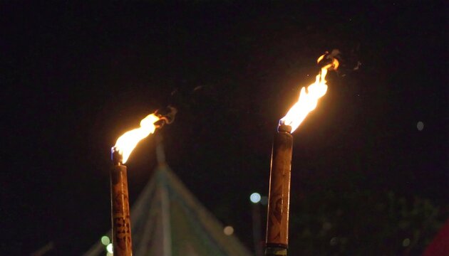 Burning Torches at Night.